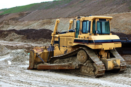 What is the difference between track roller and carrier roller?